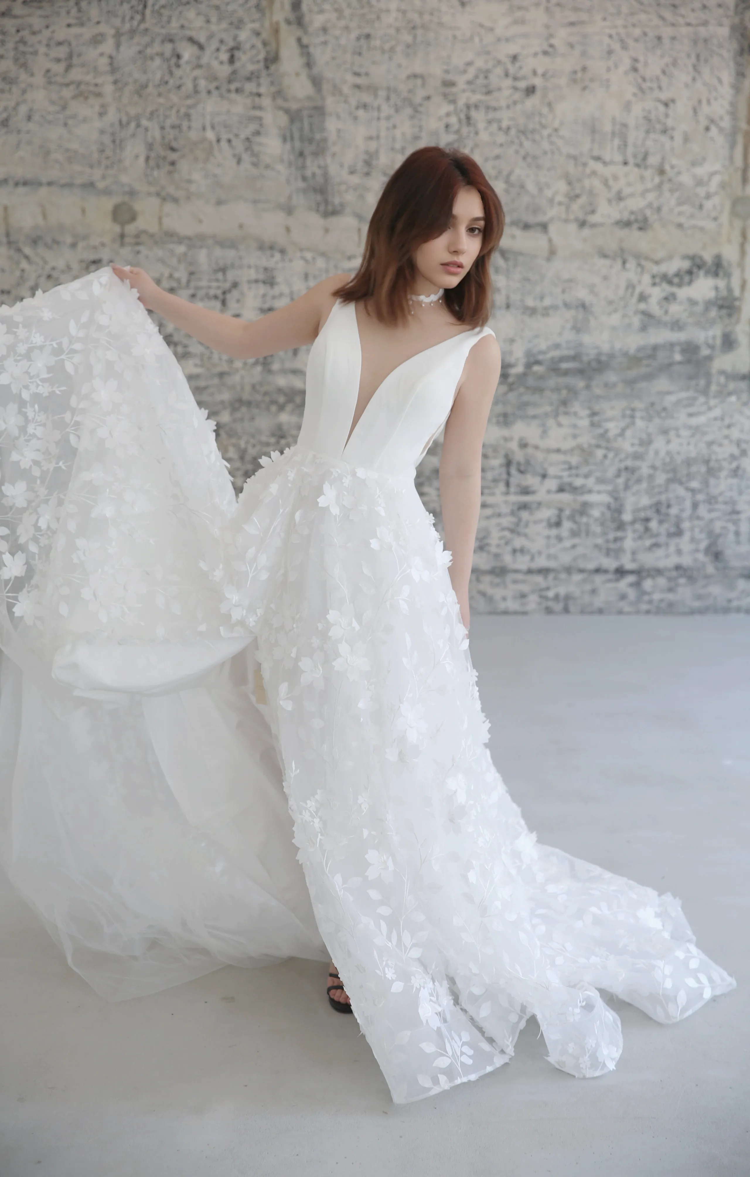 Style E2408 - Deep-V neck Satin bodice 3D floral lace skirt A-line thigh slit modern wedding dress